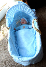 blue / turquoise dolls moses basket with covers and dressed doll