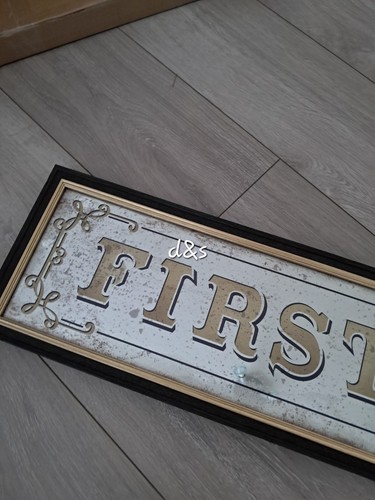 Next first class sign - next, plaque