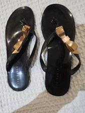 Ted Baker Black / Gold Flip Flops Size 41 / 7-71/2 Pre Owned  Good Condition