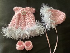 Hand knitted dolls clothes to