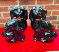 A pair of Antique Mantle Dogs