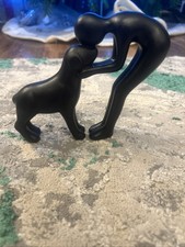 Human and Dog Statue