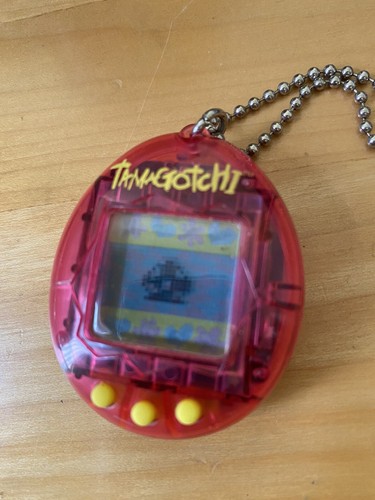 Tamagotchi translucent pink - ,