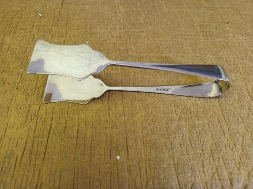 Pair serving tongs marked - pair,