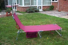 Casaria "Ibiza" foldable sun lounger with sun shade and side pocket, deep pink. 