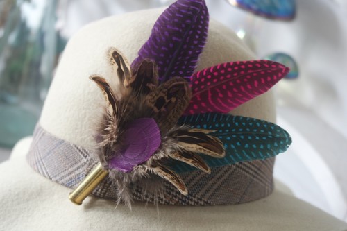 Feather and bullet brooch hat - and,