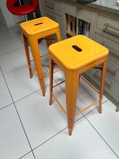 Tolix Style Bar Height Stool Orange set of two as shown 