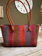 Spanish rattan handbag with leather handles.