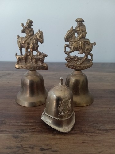 Three vintage brass hand bells - three,