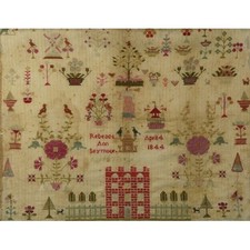 A Victorian needlework sampler framed