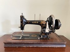 vintage old hand cranked singer sewing machine