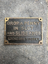 OLD BRASS DROP A PENNY IN SLOT AND SLIDE KNOB LOCKERBIES PATENT SIGN / PLATE WC