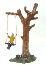 VINTAGE LEAD MODEL BOY ON TREE SWING SET