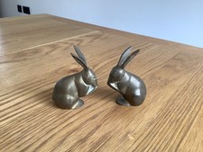 pair of brass paperweights / bookends rabbit/ hare figures. 3.5 inches tall 