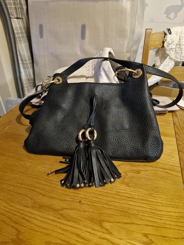 Black river island - hand, bag