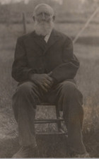 Old White Bearded Man Sitting