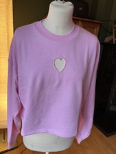 pink cropped jumper with a