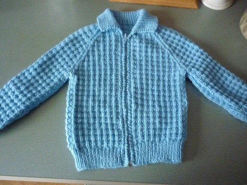 Hand knitted childs zip - , up