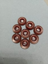 8 matching Light Brown/tan 2 hole buttons. Fronts have raised edges, backs flat