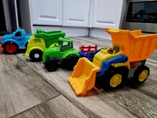 Set of four friction-powered toy construction vehicles For Kids