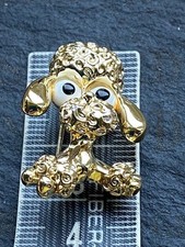 super  gold tone poodle brooch with big eyes by Gerrys creations