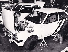 FORD FIESTA RACE CAR, ENGINE BEING WORKED ON IN WORKSHOP PHOTOGRAPH.