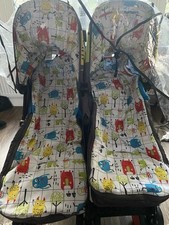 Cosatto Twin Stroller. Cuddle Monster. Includes  bag, foot muffs, 2 rain covers