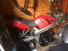 Kymco Quannon 125  Exhaust System , seats,tank,forks, many other parts.