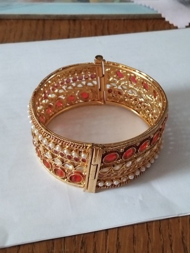 Wide gold tone hinged indian - tone,