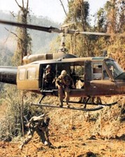 Huey Helicopter drops members