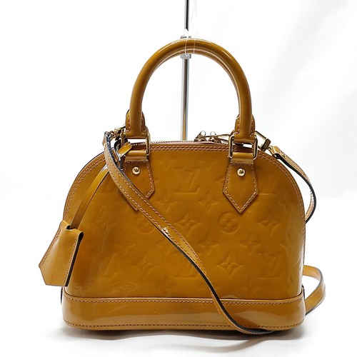 Louis vuitton hand bag alma - louis,