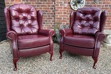 Pair Of Burgundy Button Back Leather Wing Back Armchairs