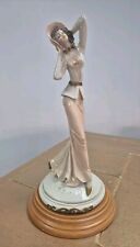 A Belcari Vintage Figurine Of A Lady With Hat And Low Cut Top