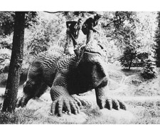 Cleaning a dinosaur sculpture