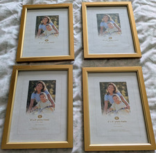 Wilko gold framed photoframes 8"x6" photos x 4. Wall or stand x 4.