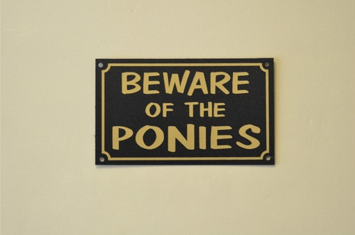Beware the ponies sign - beware,