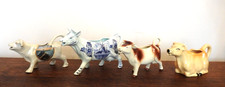 A collection of 4 Cow Creamers. Crown Devon Western Germany