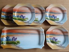Noritake serving plate and side plates with castle design.