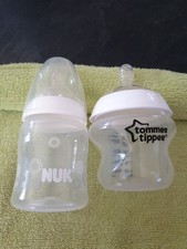 1 X Tommee Tippee 150ml Bottle, 1 X Nuk 150ml Bottle, New But Not Sealed.