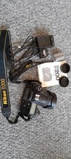 Nikon D200 + Nikkor 18-70mm 3.5-4.5 Lens, charger, spare battery, manual