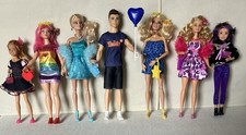 A Variety Of Used Barbie And