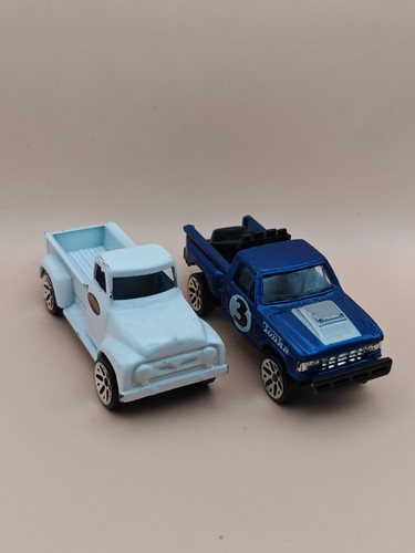 Two maisto diecast trucks - two,