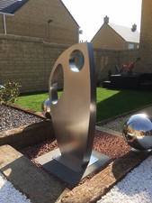 Large stainless steel garden sculpture.