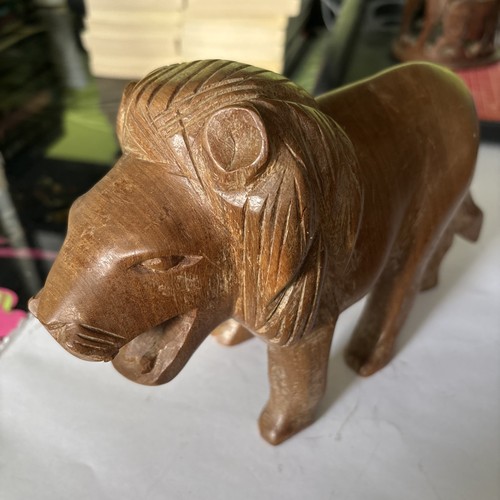 Hand carved wooden lion brown - hand,