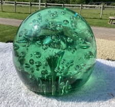 Large Victorian green glass dump end of day paperweight, bubbles