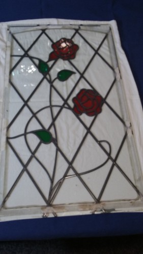 Glass door panel with leaded