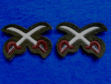 A PAIR NEW BRITISH ARMY PHYSICAL TRAINING INSTRUCTOR TRADE ARM BADGES