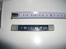 CLASSIC TRIUMPH BADGE.