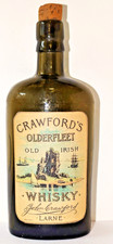 IRISH WHISKEY BOTTLE. CRAWFORDS OLD IRISH WHISKEY .LARNE. 7.40 inches tall