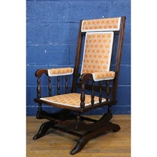A Victorian Carved & Turned Walnut American Rocking Chair Freshly Reupholstered